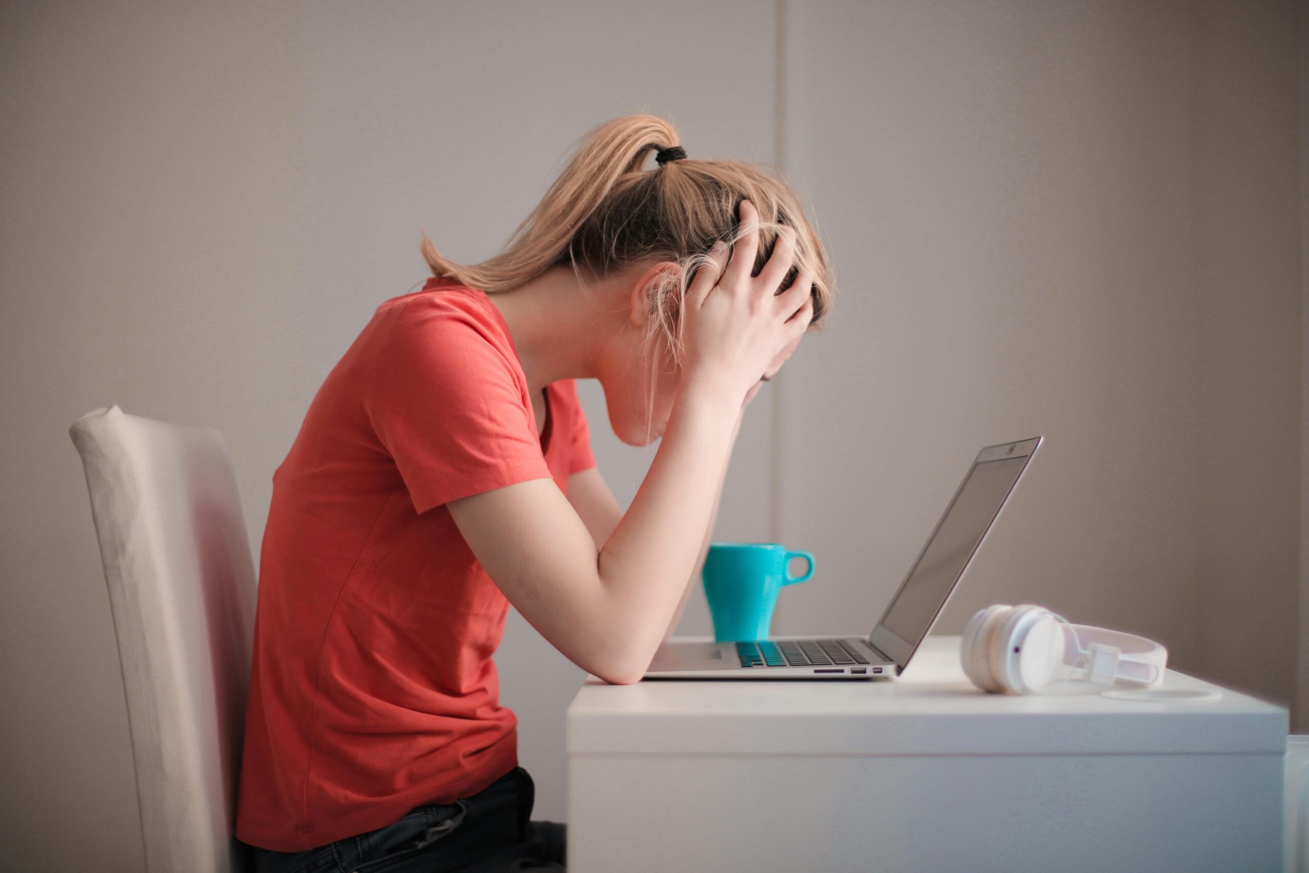 Women with anxiety looking at computer